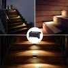 Solar LED outdoor deck and garden lights illuminating wooden stairs and deck surfaces