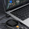 A digital handheld microscope with an LED light is placed on a laptop keyboard and a transparent grid.