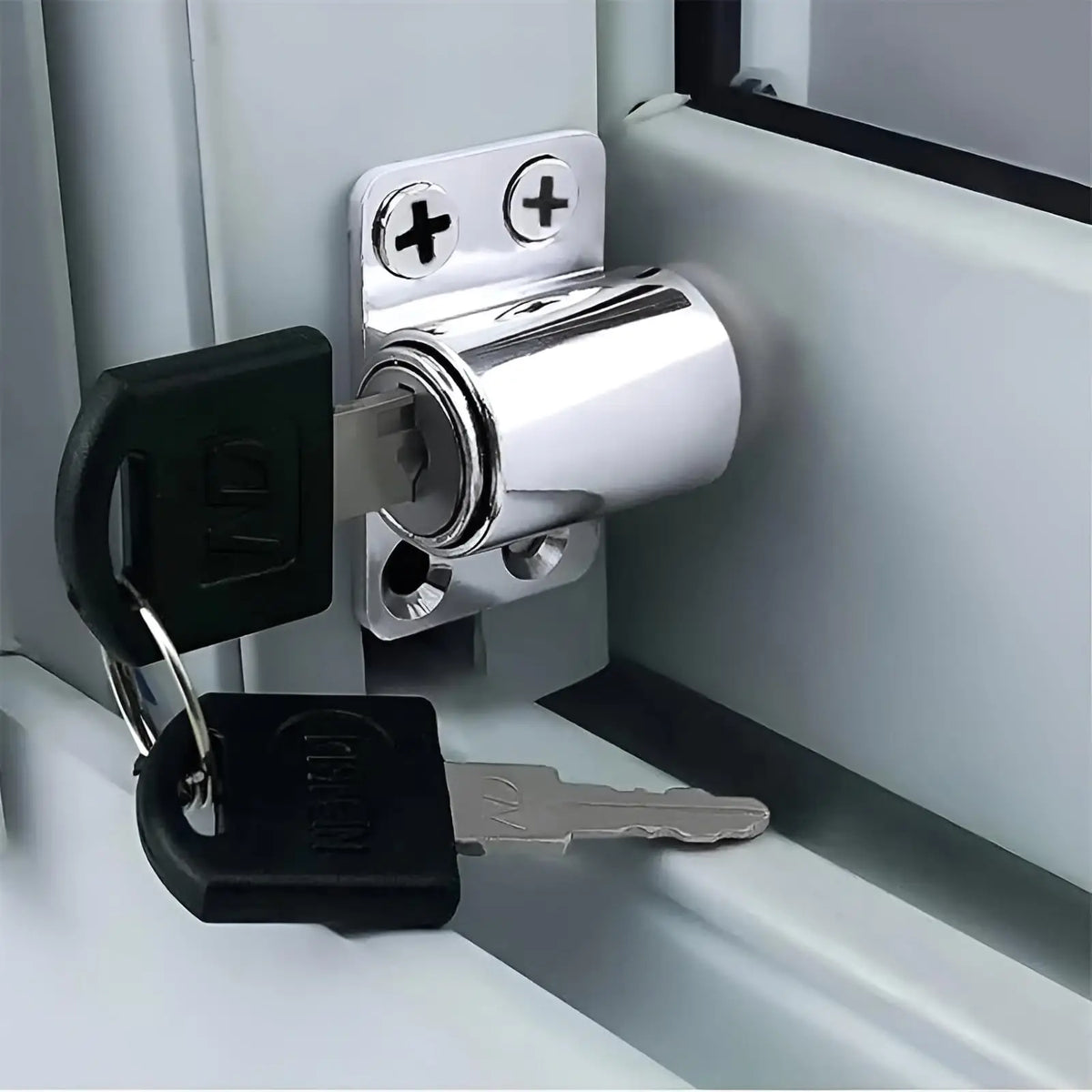 A silver and black 2-in-1 sliding door window lock set with a key and padlock attached.