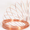 A coil of high-conductivity bare copper wire forming a decorative, spiky shape.
