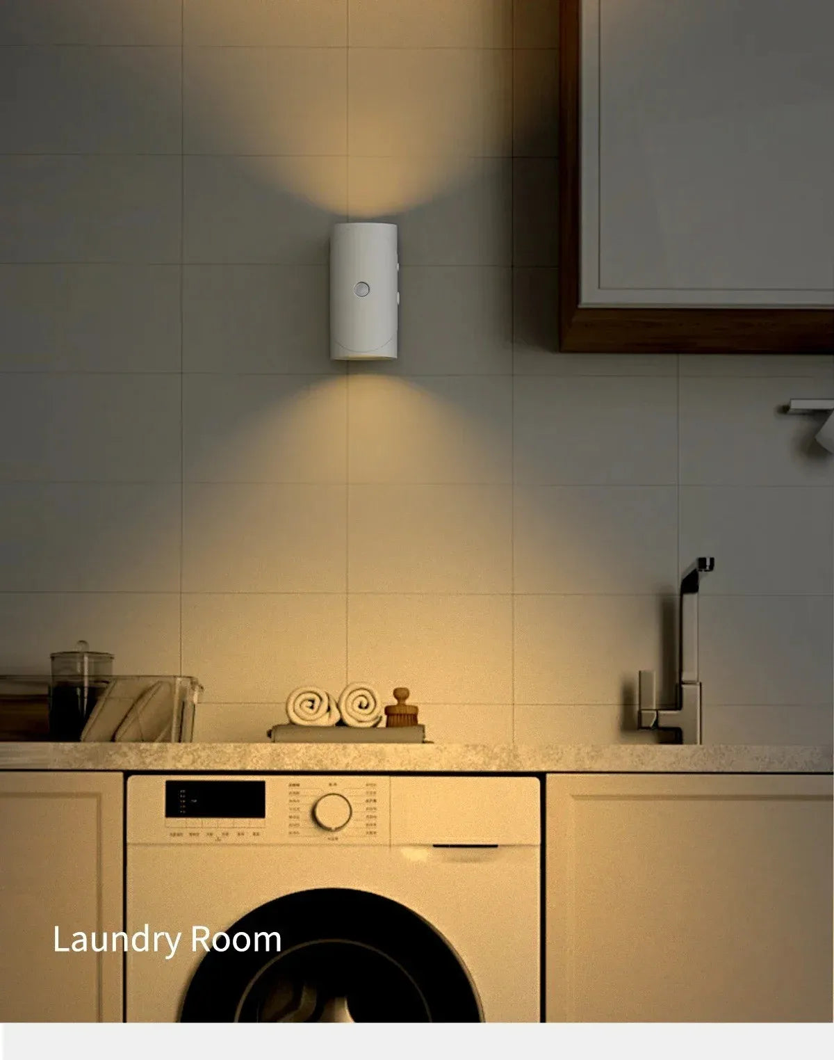 A modern white RGB motion sensor wall light illuminates a laundry room area above a countertop.