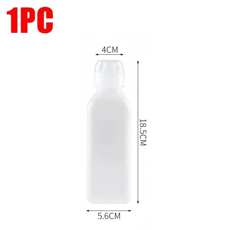 A white squeeze dispenser bottle with a pump top, measuring 4cm in height and 5.6cm in width.