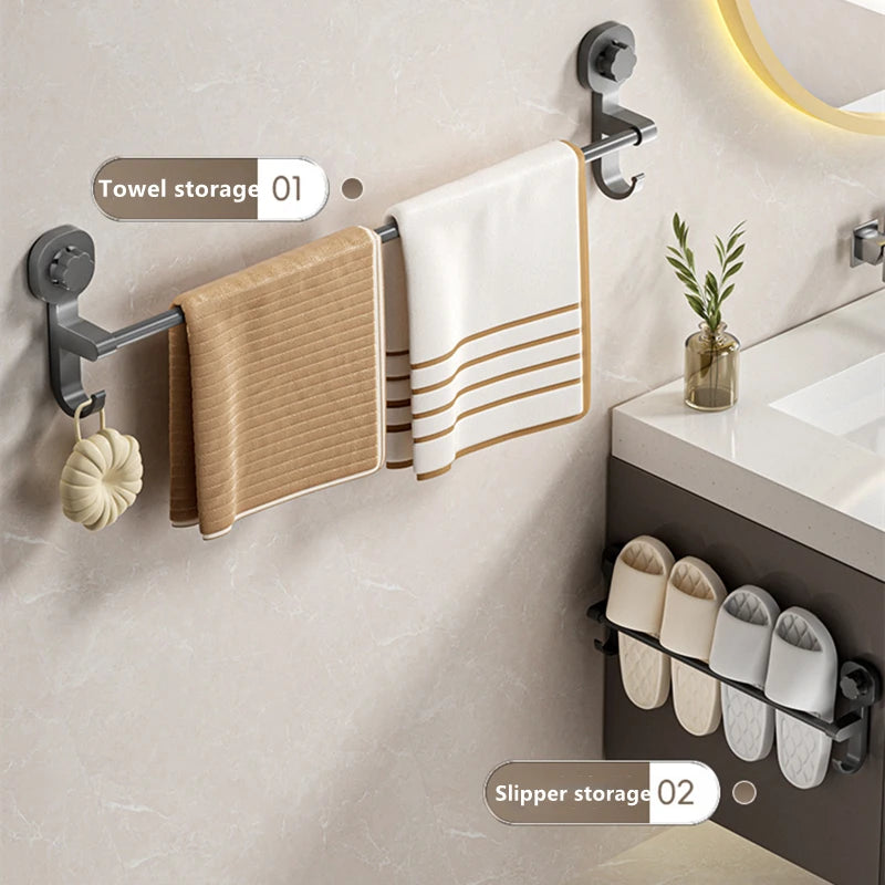 A wall-mounted towel rack displaying a folded white towel and a striped towel, with adjacent slipper storage visible.