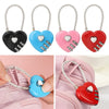 Red and pink heart-shaped combination locks with silver keys displayed on a pink fabric background.
