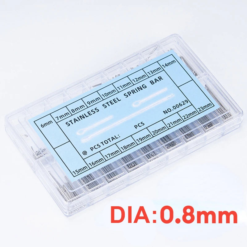 A clear plastic container holding a set of stainless steel spring bar pins and connecting links for watch bands.