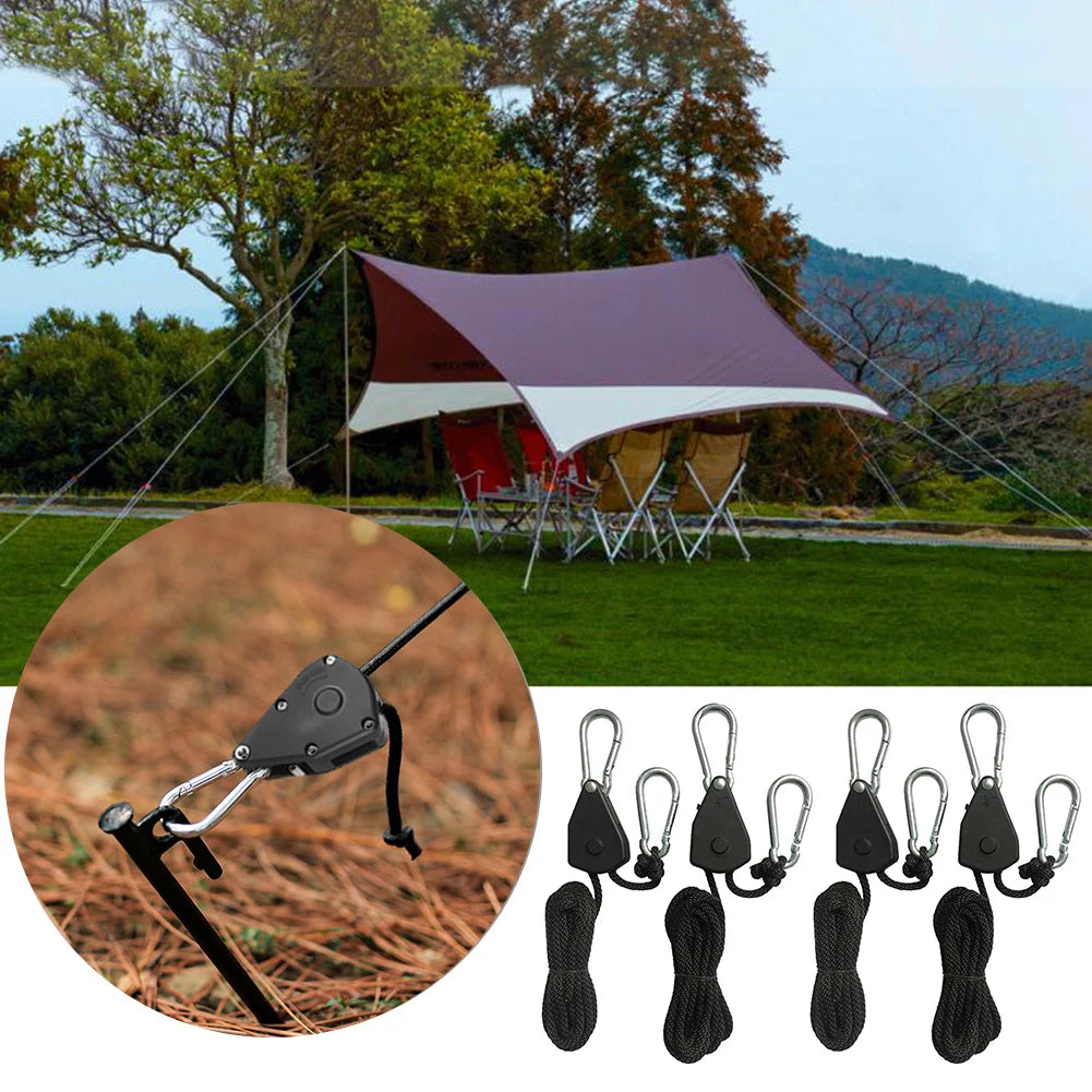 A multi-pack of black utility lanyards shown next to a large tent in an outdoor setting.
