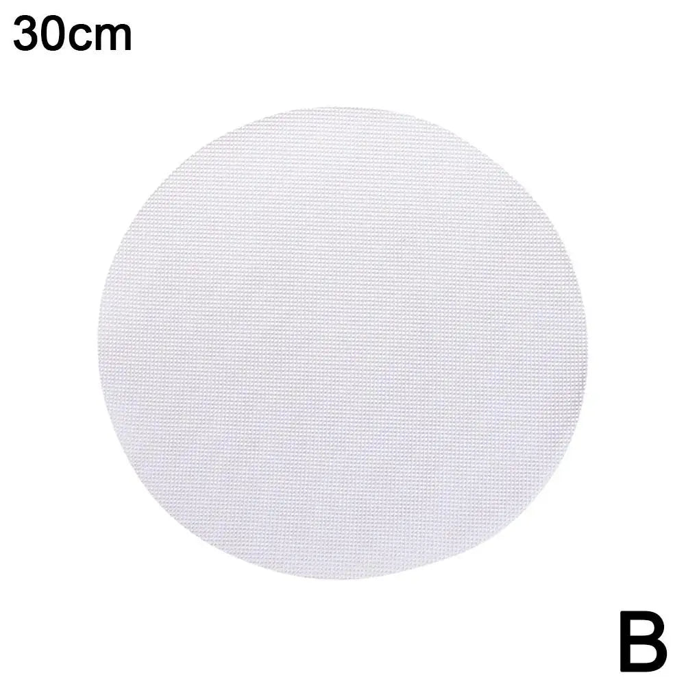 A round, white silicone steamer mat with a 30cm diameter.