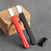 A red and black multi-purpose knife and shears sharpening stone resting on a wooden block.