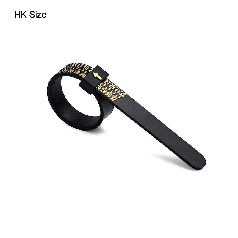 A black precision plastic ring sizer with numbered markings is shown against a white background.
