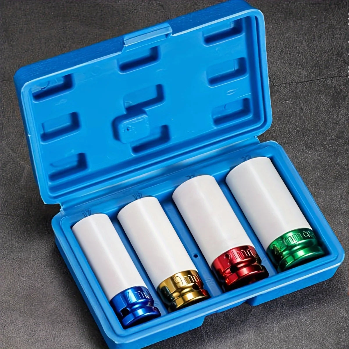 A blue plastic case containing five white and red socket bits for drive wheels.