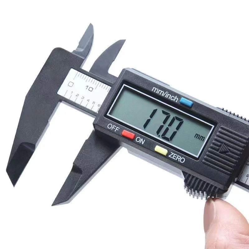 A black digital caliper with a scale showing 170 mm and various measurement markings.