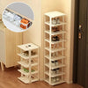A white stackable vertical shoe rack organizer with multiple tiers for storing shoes in a home setting.