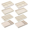 A set of light beige plush velvet jewelry storage trays in various rectangular and square shapes.