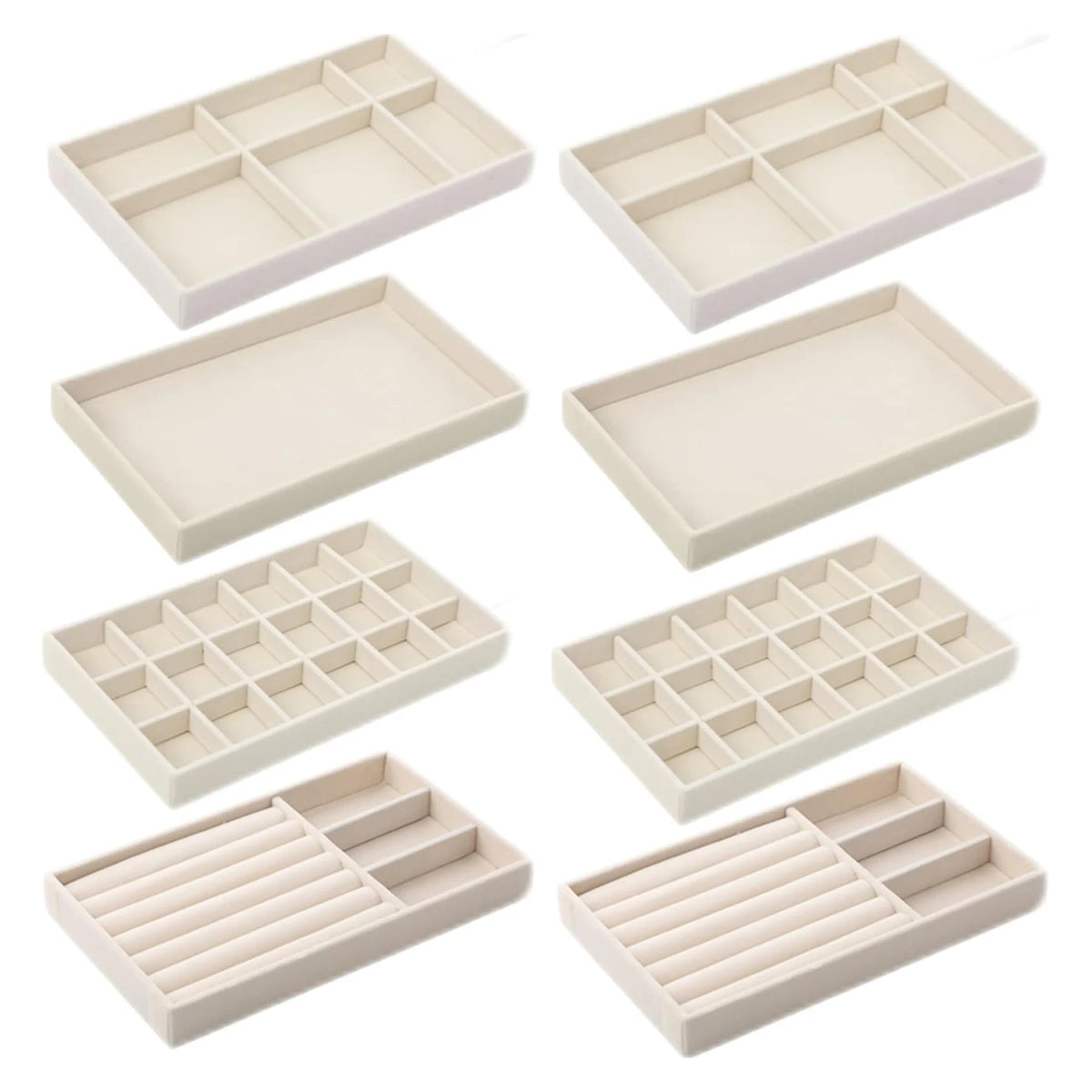 A set of light beige plush velvet jewelry storage trays in various rectangular and square shapes.