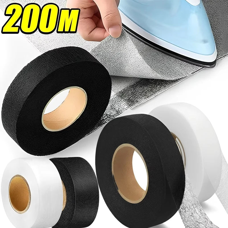 Rolls of black and white iron-on hemming tape for fabric edging shown next to a hand.
