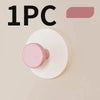 One reusable suction cup hook in a pale pink color shown against a neutral background.