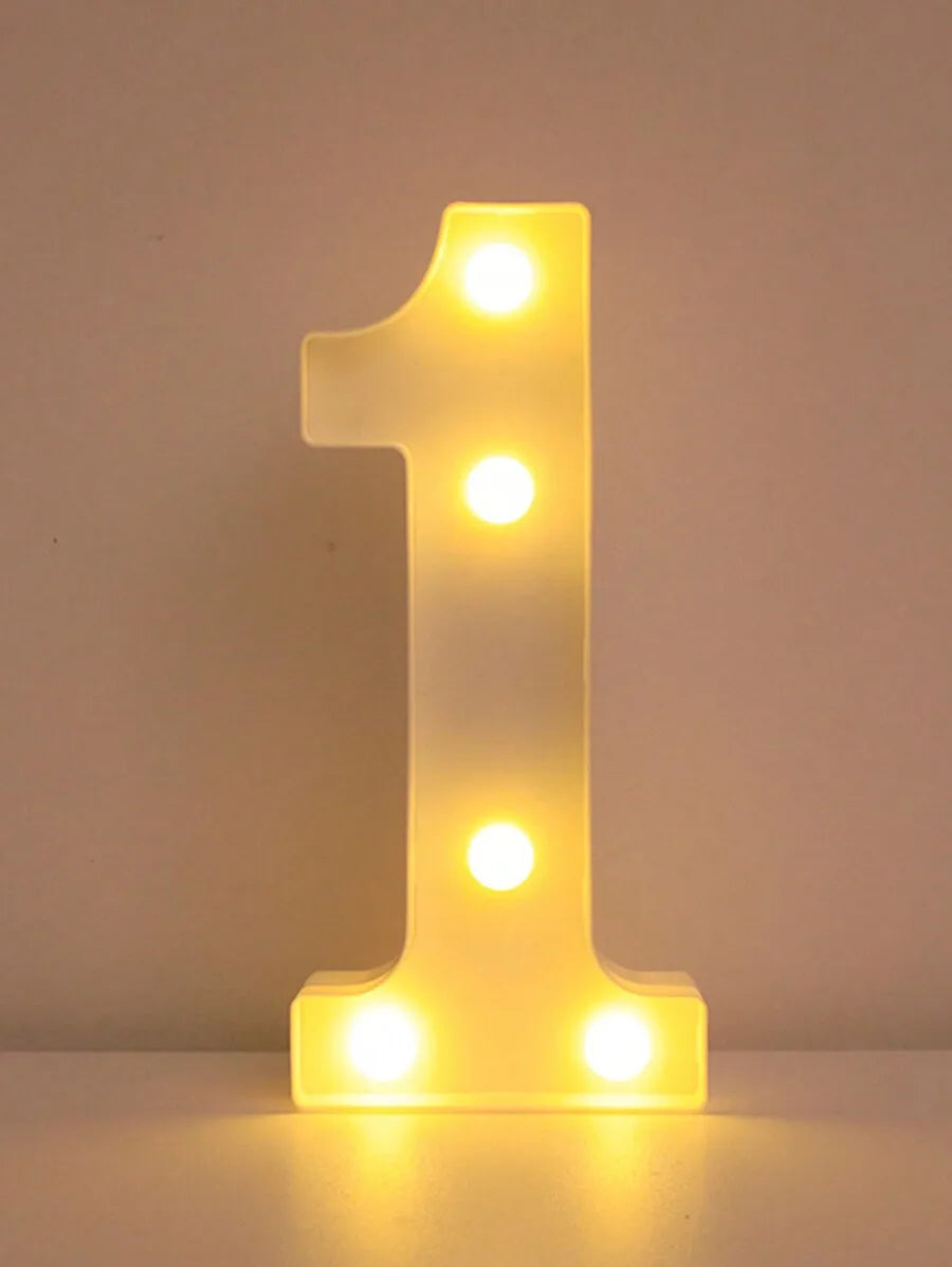 Luz nocturna de letra '1' amarilla brillante LED con múltiples puntos iluminados.