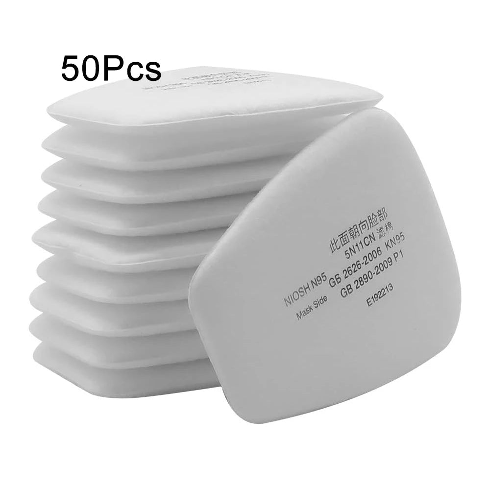 A stack of 50 high-performance dust filter cotton masks for gas masks, showing the individual mask side.