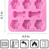 Set de moules en silicone roses avec des formes d'empreintes et d'os de chien pour la création ou la pâtisserie.