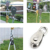 Stainless steel wire rope pulley block with a metal hook and chain attached to a white rope.