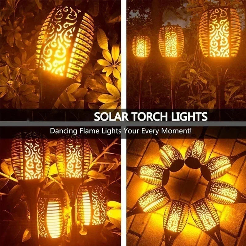 A set of solar torch lights with dancing flame patterns illuminating outdoor plants at night.