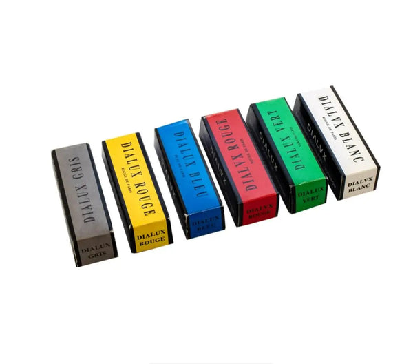 A row of ten professional stainless steel polishing wax kits in various colors including gray, yellow, blue, red, green, and 