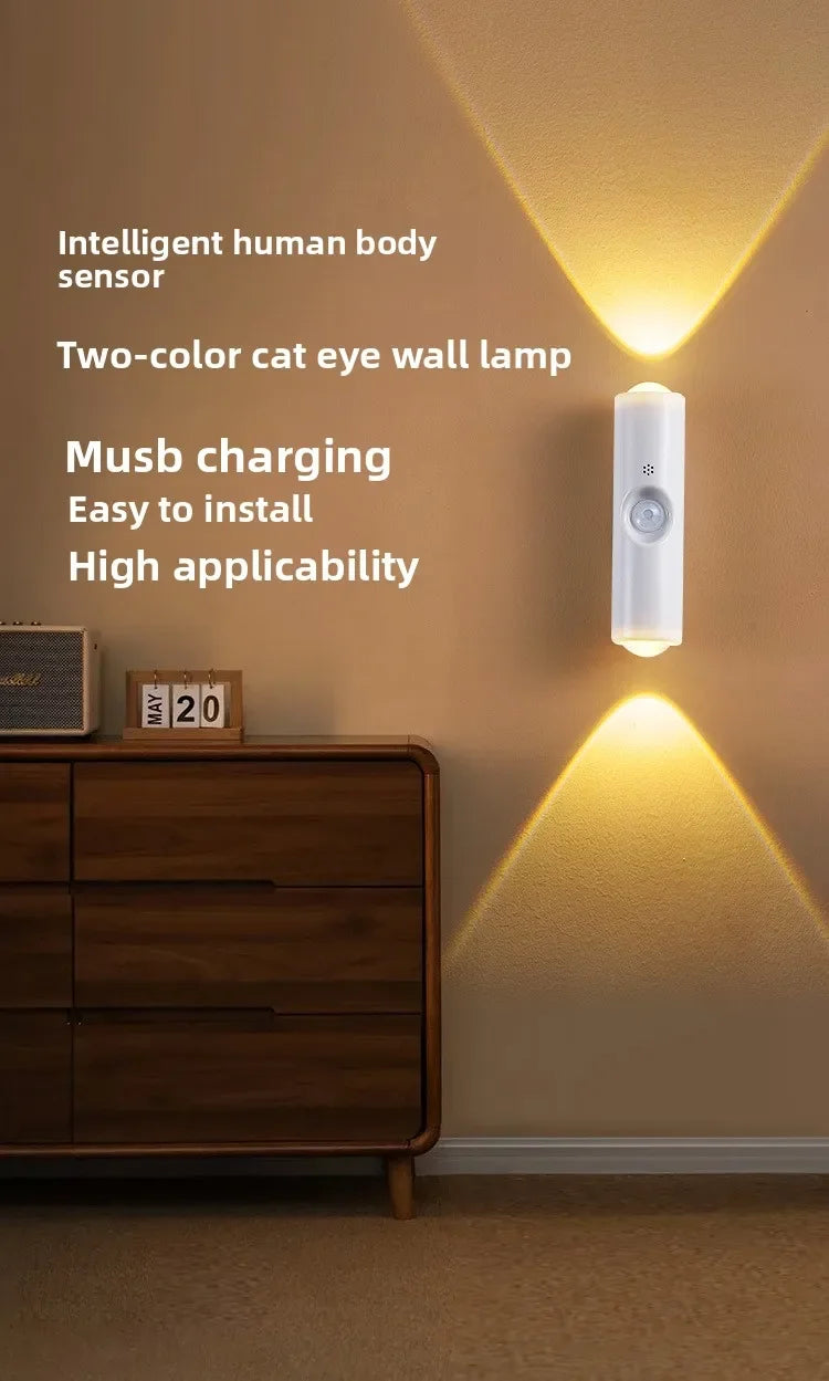 A white wall lamp with a cat eye design illuminates a wooden cabinet.