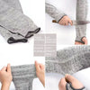 Close-up view of gray cut-resistant arm sleeves showing fabric texture and elastic cuff detail.