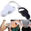 A white self-measuring body tape ruler is shown in various angles, including a close-up of it being used on a person's body.