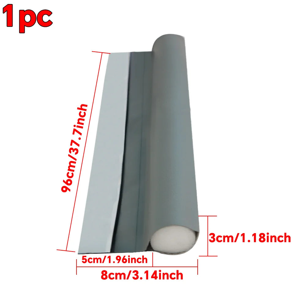 A silver adjustable door draft stopper with a cylindrical shape shown in profile.