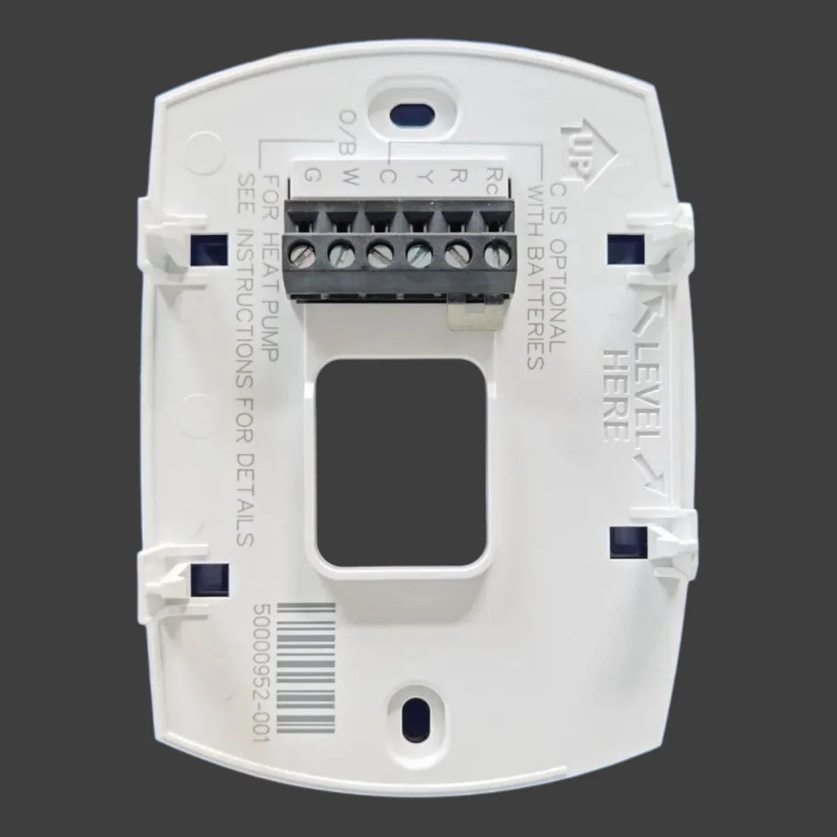 A white digital thermostat for heat pump systems with various connection points and a display window.