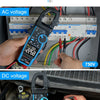 A clamp meter is shown measuring 1000V DC voltage in an automotive context.