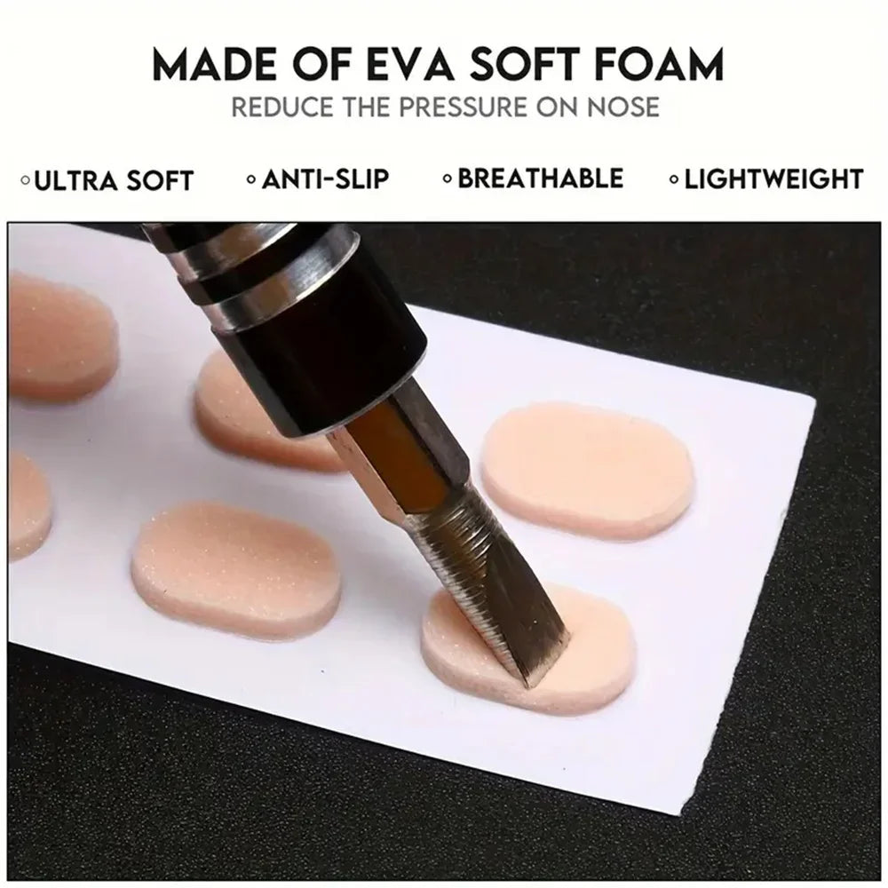 A close-up view of soft pink self-adhesive anti-slip nose pads being applied to a white surface.