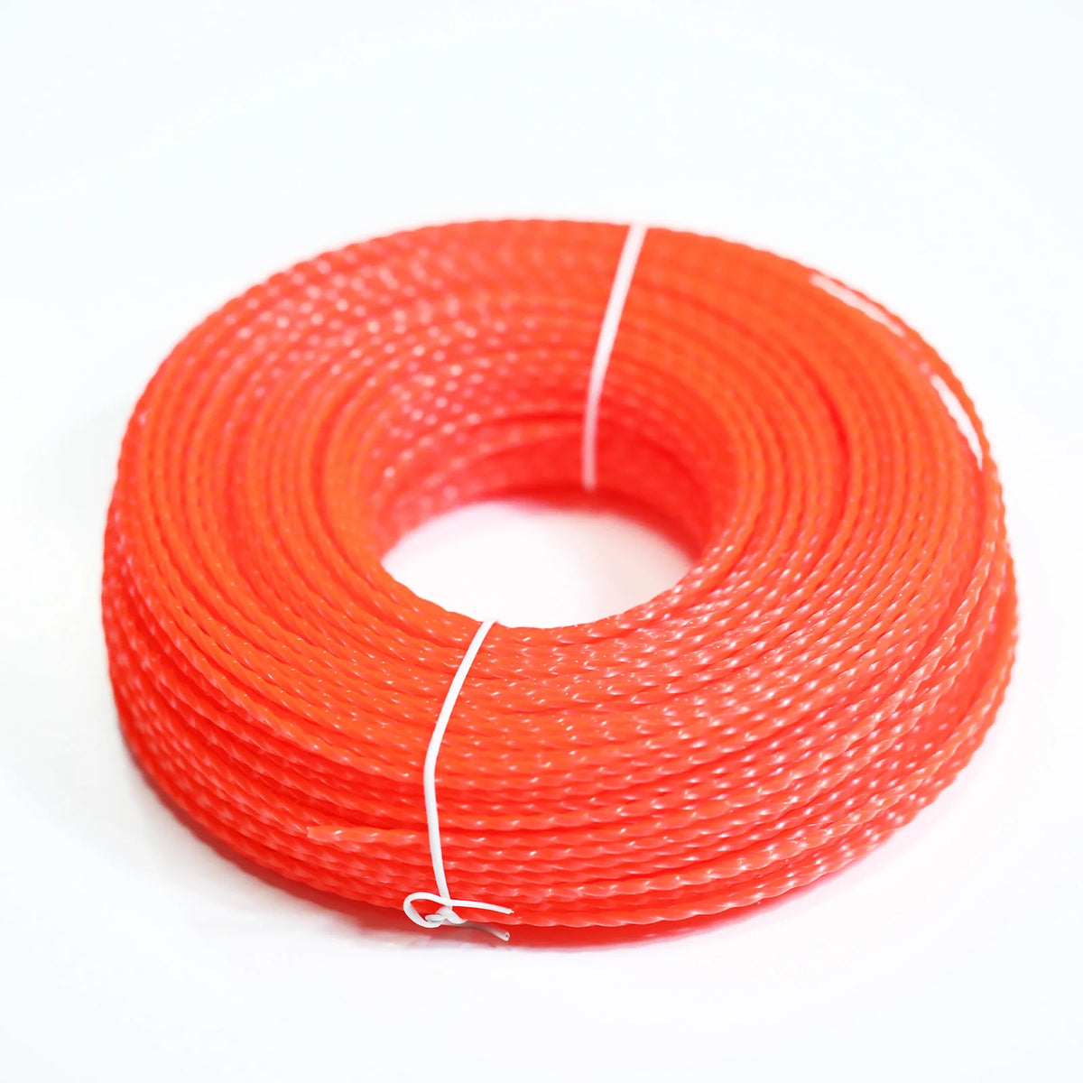 A coil of bright orange heavy duty lawn trimming line with white string visible.