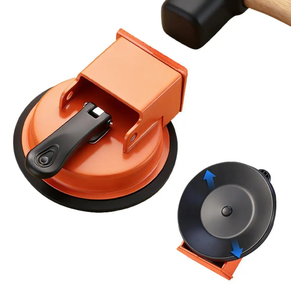 Outil de réparation d'espace au sol orange avec poignée noire et base circulaire.