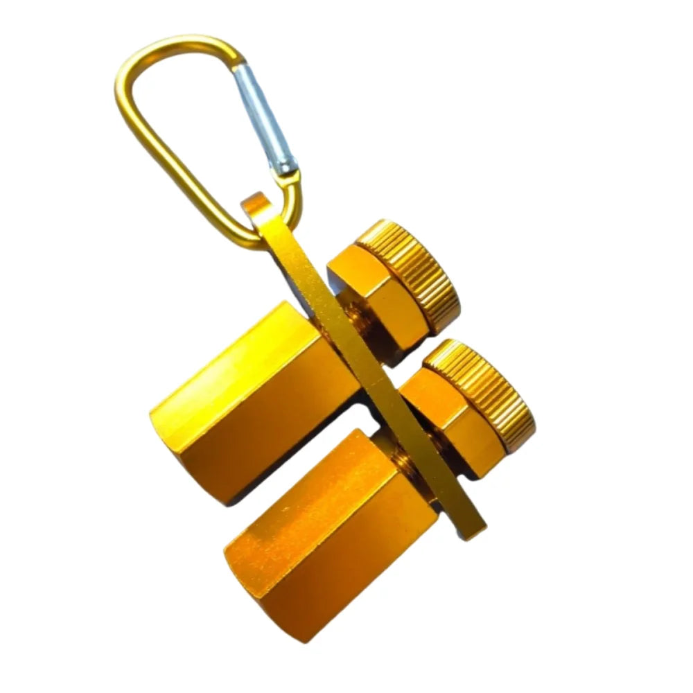 A brass precision stair gauge framing square with a loop for hanging.