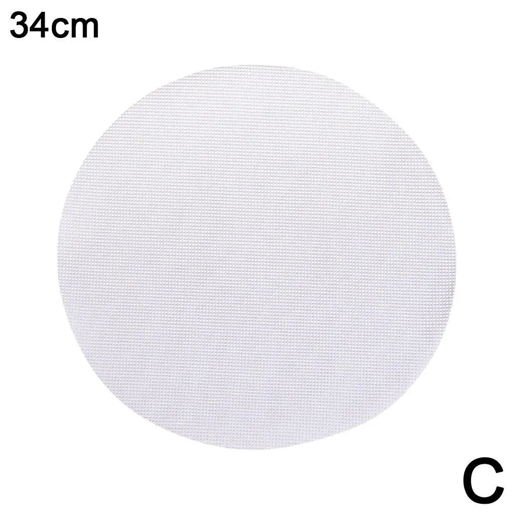 A round white silicone steamer mat with a 34cm diameter.