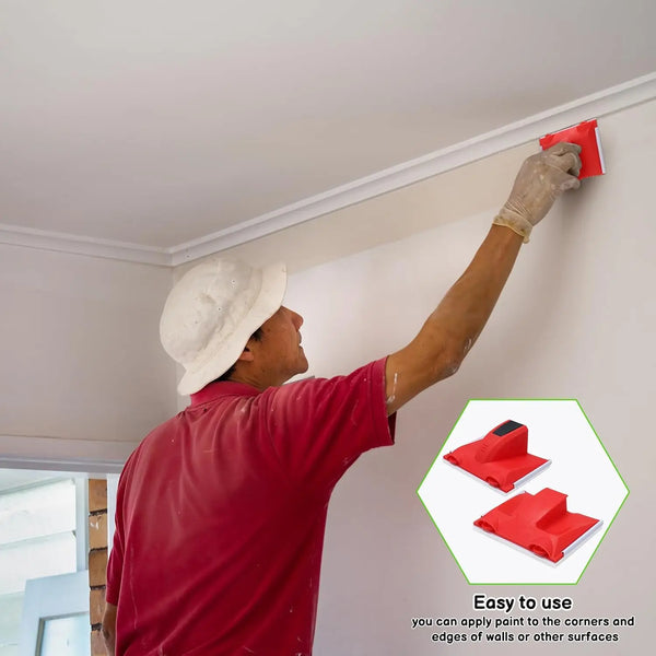 A person is using a red precision paint edger tool to trim corners and edges of walls.