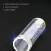 A clear plastic injector tube with markings is shown against a dark background.