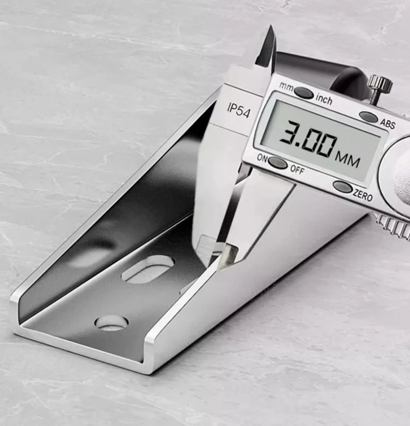A close-up view of a silver measuring tool displaying 3.00 mm, used for furniture casters.