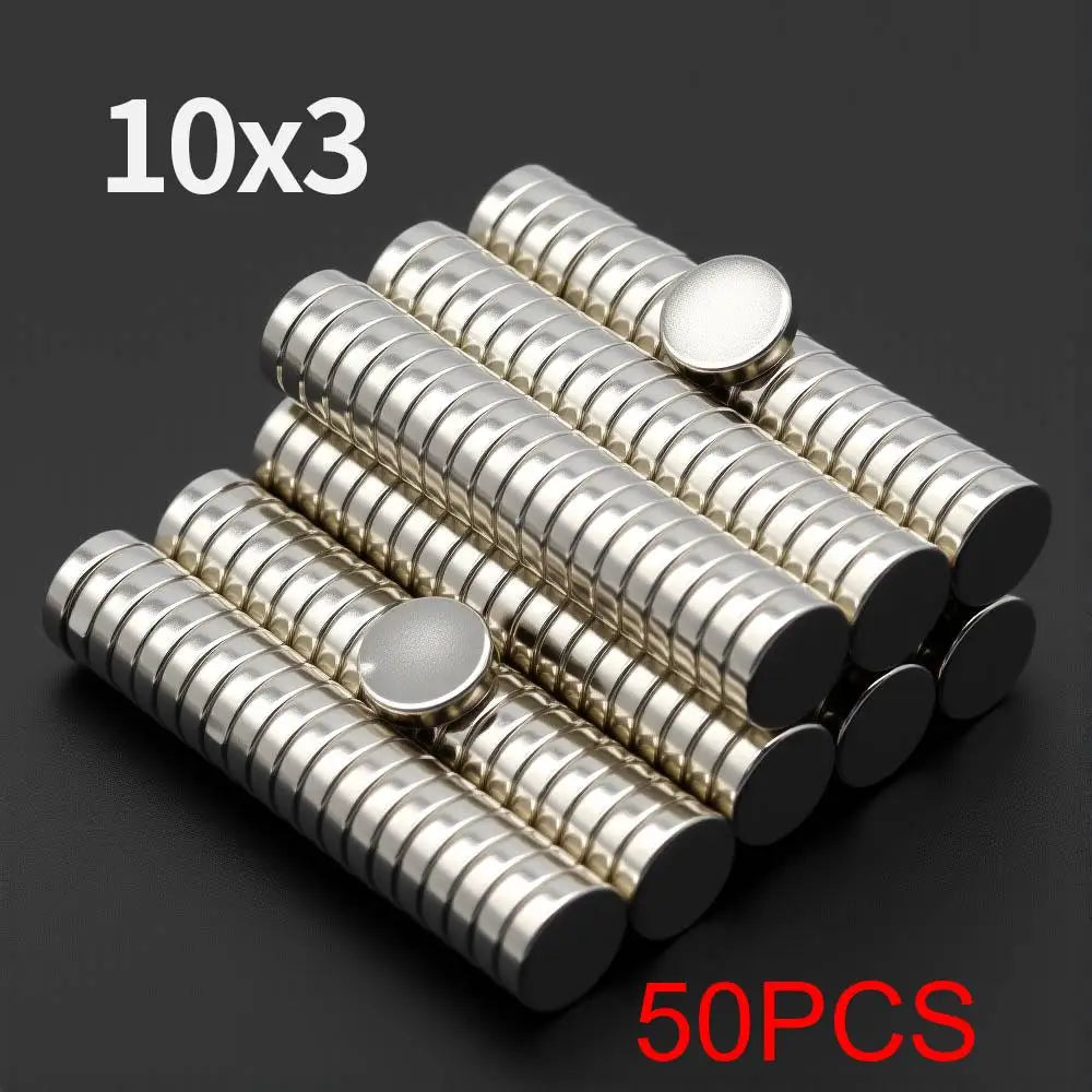 A collection of 50 fridge magnets, arranged in 10 rows of 3, showing silver-colored cylindrical magnets.