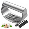 A manual stainless steel garlic and ginger press with a perforated plate and accompanying tools.