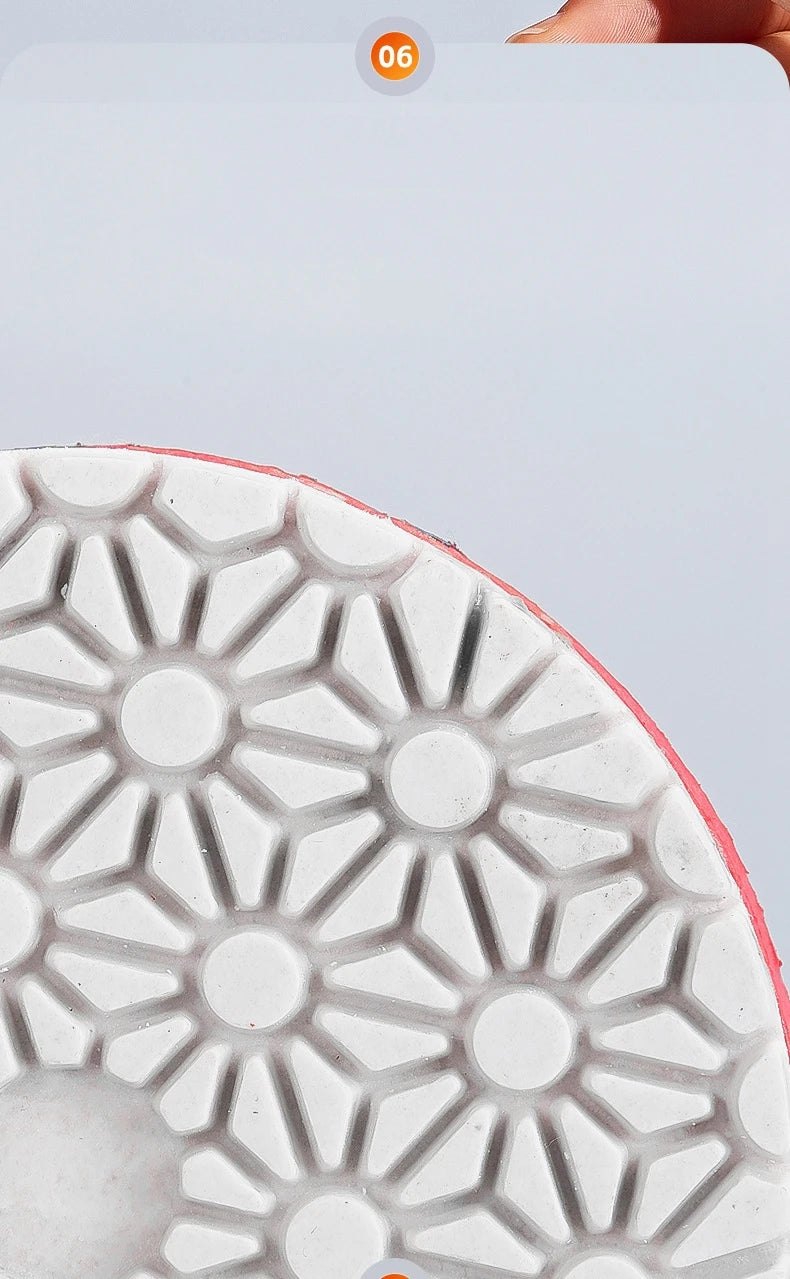 Close-up view of a white polishing disc with a geometric pattern on the sole.