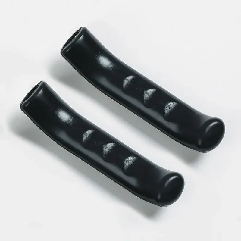 Black silicone brake lever protector covers for bicycles shown diagonally on a white background.