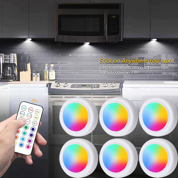 Set of five round RGB under cabinet LED lights with a wireless remote control