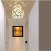 Crystal LED chandelier lamp hanging in a hallway with a framed light display.