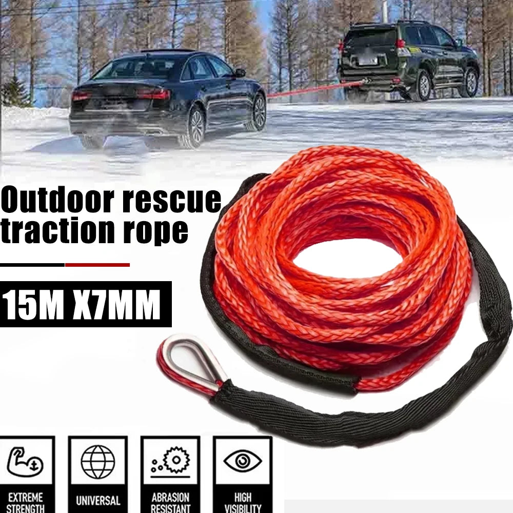 A spool of red rescue traction rope is shown next to a black SUV in an outdoor setting.