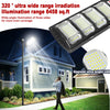 A rectangular LED light fixture is shown illuminating a house exterior at night.