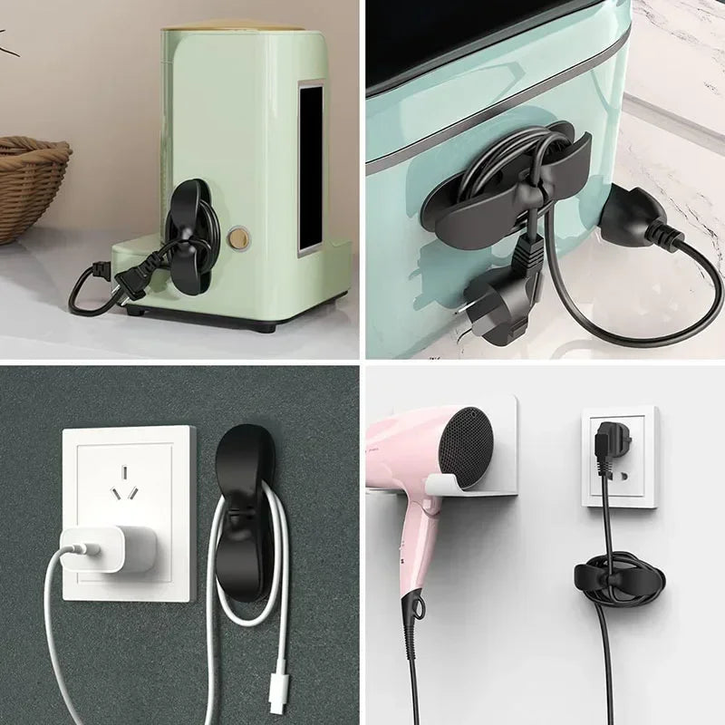 Pinkes wiederverwendbares Silikon-Kabelorganisatorclip, montiert an einer weißen Wand, mit einem schwarzen Kabel.