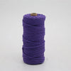 A spool of 100m natural cotton macrame cord in purple.